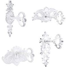 three white decorative pieces on a white background, one is shaped like a cross and the other has an ornate design