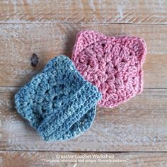 two crocheted dishcloths sitting on top of a wooden table