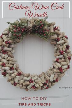 a wreath made out of wine corks with holly and red berries on the front