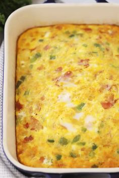 a casserole dish with cheese and vegetables in it