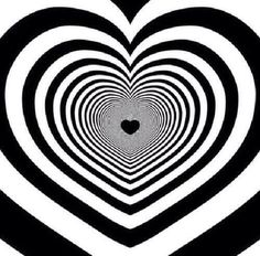 a heart shaped black and white pattern with a hole in the center