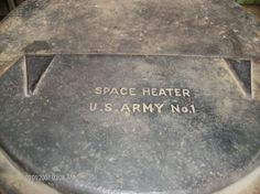 the base of an army tank with space heater written on it