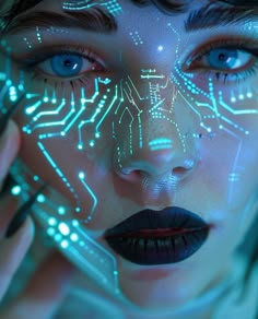 a woman's face is lit up with electronic circuitry and blue eyes, while she holds her hand to her cheek