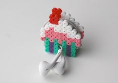 an earphone is made out of legos and has a cupcake on it