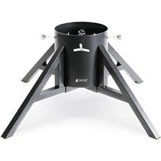 an outdoor stove with two legs and a pot on the top, sitting on a white surface