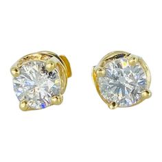 Vintage 2.00 Carat Total Diamonds Stud Earrings Patented Backing 14k. The diamonds color are H/I & clarity are SI2-SI3 very nice pair of studs. The center diamond each weight approx 0.76 carat and surrounding diamonds 16 stones X 0.03ct = 0.48 carat for a total of 2.00 carat diamonds. The prong setting is a swivel designed and is extremely elegant. The side diamonds compliment the center diamonds and bring out maximum sparkle and shine! The earrings are accompanied by patented back closure for m