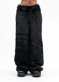 Faux fur devil pants in black from kidill. features a relaxed construction with four-pocket styling and a tail charm secured at the rear hem with a silver-tone lobster-claw mechanism. tonal stitching throughout.    oversized fit  shell: 100% polyester  lining: 100% polyester  made in japan    model is wearing size 46    model is 5'7" (172 cm) 98 pounds (44kg) usually wears s in tops. a size 25in denim and s in trousers. size 8 in shoes. Fur Pants, Japan Model, Leather Heeled Boots, Denim Hat, Black Crane, Sea Ny, Simon Miller, Straight Trousers, Patent Leather Heels