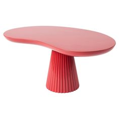 a pink table with pleated edges on an isolated white background for use in interior design