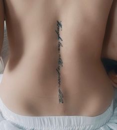 the back of a woman's stomach with writing on it