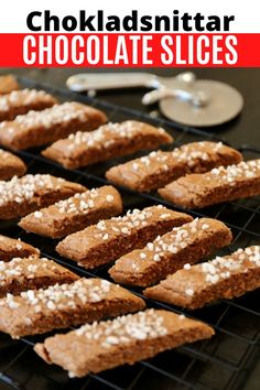 chocolate slices on a cooling rack with spoons and utensils in the background