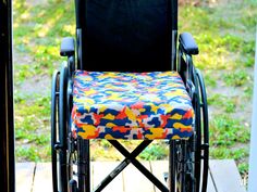 a wheelchair that is sitting outside on the porch with it's foot propped up