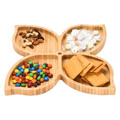 three wooden trays filled with different types of food and snacks on top of each other