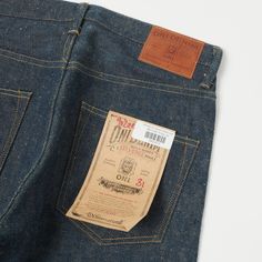 ONI’s 902 jean is a relaxed tapered model with a classic 5-pocket top consruction. This model features a mid rise which sits comfortably on the waist and gives a little more room in the thigh before tapering gradually down to the ankle, and to add a little more interest, they have crafted this model from their mysterious ‘secret denim’. This 20oz low tension denim has the unique slubby patina that we have come to expect from the brand and is paired with a beige dyed weft which flecks through the surface of the fabric at irregular intervals, giving the denim a raw heritage feel. The fabric has been expertly woven in the iconic ONI fashion which ensures that as the denim is broken in by the wearer, the cotton softens and the indigo fades away in a manner unique to the individual. The manufac Model Features, Tapered Jeans, Pocket Top, Patina, Mid Rise, Fabric