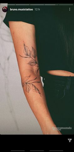 a woman with a tattoo on her arm