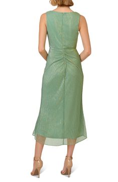 Cut from novelty knit fabric with shirring on the back and a billowy ruffle on the front, this dazzling dress is the one to wear for your next special occasion. 43" length (size 8) Hidden back-zip closure Surplice V-neck Lined 58% metallic fibers, 42% polyester Spot clean Imported Green Evening Dress With Ruched Back, Green Ruched Back Evening Dress, Stretch Party Dress With Pleated Back, Green Crinkle Texture Dress For Summer, Green Ruched Dress For Party Season, Green Crinkle Texture Dress For Spring, Elegant Midi Dress With Crinkle Texture, Elegant Midi-length Dress With Crinkle Texture, Chic Fitted Dress With Crinkle Texture