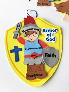 an ornament with the words salvation, armor of god and faith on it