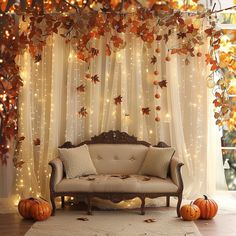 a living room decorated for halloween with pumpkins and lights on the walls, couches and curtains