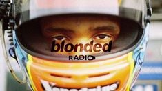 a man wearing a helmet with the words blonded radio on it's side