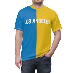 Get Ready for Game Day  Sport this comfortable unisex shirt while watching your favorite team.  Show your team spirit everyday in style. Uniquely textured, thick microfiber knit fabric of this high quality t-shirt wicks perspiration rapidly away from the skin, drawing it to the surface where it quickly evaporates.  100% Polyester Light fabric Regular fit Tagless Runs true to size Blue Crew Neck Sublimation Fan Gear, Team-colored Short Sleeve Sublimation Design For Streetwear, Blue Jersey Sports Fan T-shirt, Blue Crew Neck Sublimation Sports Fan Shirt, Blue Crew Neck Sublimation Sports Fan Design, Blue Sports Fan T-shirt With Sublimation Print, Relaxed Fit Sports Fan T-shirt, Team-colored Sports Fan T-shirt With Crew Neck, Sports Fan T-shirt For Fan Merchandise