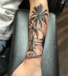 a palm tree with the word california tattooed on it's arm, sitting on a chair