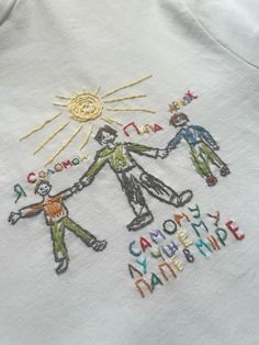 embroidered t - shirt with children holding hands and the words, someone is my friend