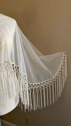 "Off-white Wedding capelet Boho vibe with a deep 10\" fringe Lots of movement One size - fits most! Front length 23\" Back length 33\"" Elegant Fringe Shawl For Wedding, Elegant Fringed Shawl For Wedding, Bohemian White Shawl Cape, Fitted Bohemian Shawl For Wedding, Elegant One Size Fringe Shawl, Elegant One Size Shawl With Fringe, One Size Elegant Shawl With Fringe, Elegant One-size Shawl With Fringe, White Bohemian Shawl With Fringe