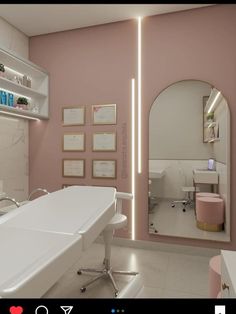 a bathroom with pink walls and white furniture