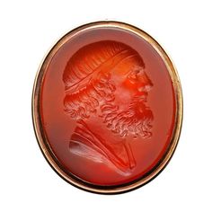 A Georgian carnelian intaglio ring, the oval cornelian measuring 21 x 18mm, seal-engraved with a classic male head, bearded and in profile, in a yellow gold setting with an open back and tapering gold shoulders. The finger size of most of our rings can be adjusted and our workshop will be happy to do this free of charge. If you do not know your finger size please request us to post you a finger measure. Should you choose to make this purchase we would be delighted to send it to you in a Bentley Diamond Signet Ring, Carnelian Jewelry, Carnelian Ring, Pearl And Diamond Ring, Signet Rings, Carnelian Stone, Gold Signet Ring, Yellow Gold Setting, Three Stone Rings