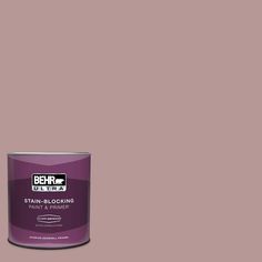 a can of behrut ultra stain - blocking paint on a pink background with the words