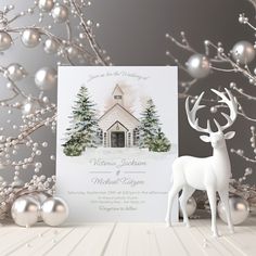 a christmas card with a deer standing next to it