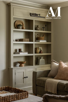 a living room filled with furniture and a book shelf next to a couch in front of a window