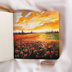 an open book with a painting on it