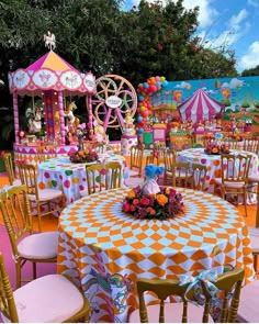 an outdoor party with colorful tables and chairs