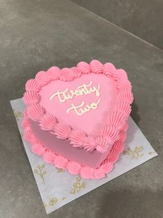 a heart shaped cake sitting on top of a table