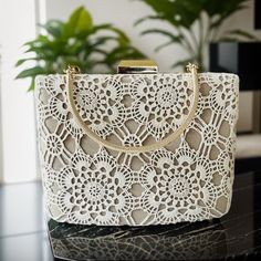 "Once upon a time, in the hands of a beloved grandmother, intricate lacework became a testament to the craftsmanship of bygone eras. Introducing the \"Vintage-Inspired Grandma's Lace Bag,\" a unique design adorned with special lacework that dates back 30-40 years--a true masterpiece that effortlessly blends the elegance of the past with the contemporary. Features: Timeless Elegance: Your grandmother's handcrafted lacework adorns the surface of the bag, with each detail serving as an expression of respect for the handicrafts of yesteryear. Durable Design: Crafted from high-quality materials, the bag not only offers sophistication but also practicality for everyday use. Functionality: The spacious compartments and showcase that the bag is not only elegant but also incredibly functional for d Vintage Cream Bag For Wedding, Vintage Cream Bags For Weddings, Elegant Embroidered Bags For Ceremony, White Embroidered Evening Bag For Wedding, Intricate Embroidery Evening Bag For Wedding, Formal White Embroidered Bag, Formal White Embroidered Bags, Vintage Rectangular Wedding Bags, Vintage Beige Clutch For Wedding