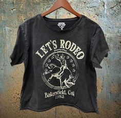 Let's Rodeo Bakersfield California acid wash regular Cropped T-shirt 4.0 oz., 50/50 combed ringspun cotton/polyester Solids: White are Vintage Jersey So soft Acid Wash Set-in ribbed neckband Double-needle stitching at sleeve & bottom hem Tearaway label Jersey Vintage, Vintage Jerseys, Outerwear Vest, Cropped Tube Top, Cropped T Shirt, Dress Gift, Crop Tshirt, Acid Wash, Bold Fashion