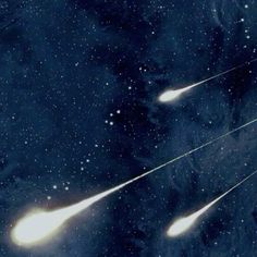 an artist's rendering of two comets flying through the sky with stars in the background