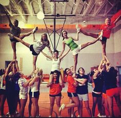 a group of young women standing on top of each other