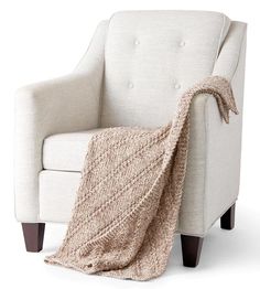 a chair with a blanket on top of it