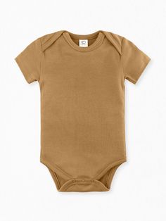 Cozy up in our favorite classic short sleeve bodysuit. Made of 100% organic cotton, it’s super soft to the touch and constructed with a lap-neck design to ensure easy, hassle-free outfit and diaper changes. Made of soft, breathable 100% organic cotton Interlock fabric Nickel-free snaps Sustainably and ethically produced with eco-friendly AZO / heavy metal free water-based dyes Naturally hypoallergenic Clothing Staples, Body Suit With Shorts, Brown Babies, Organic Colors, One Clothing, Organic Clothing, Baby Body, Organic Fabrics, Short Sleeve Bodysuit