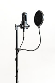 a microphone attached to a tripod on a white background