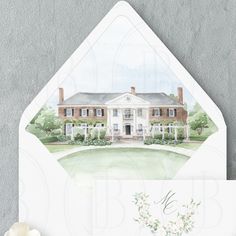 a white envelope with a watercolor painting of a house on the front and side