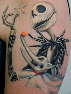 a tattoo with a skeleton holding a knife and a star on it's arm