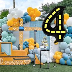 a construction themed birthday party with balloons and decorations