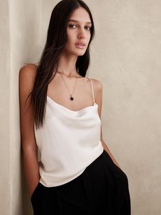 The perfect weight for everyday wear, this camisole is crafted with our signature silk charmeuse, beloved for its satin-like shine and its ability to drape beautifully when cut on the bias.  Semi-fitted.  Square cowl neck.  Spaghetti straps.  Straight hem.  Semi-fitted.  Sleeveless.  Hip length.  Body length (size S): Regular 17. 5" Model: Size S, 5'10" (178cm). Womens Camisoles, Silk Cami, Silk Camisole, Banana Republic Women, Silk Charmeuse, Cowl Neck, Womens Clothing Tops, Banana Republic, Spaghetti Strap