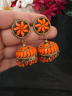 Complete your look this festive season with our lightweight and colorful chandelier jhumka earrings in orange color and antique polish! A gorgeous pair of jhumka earrings to light up your day any time! In stock and ready to ship. Color : orange Note :Color, shades, texture displayed may slightly vary from the actual product due to digital image limitations. We request you to consider these minor variations. Please expect the possibility of some slight imperfections when buying handmade jewelry. Orange Earrings Indian, Small Jhumka, Colorful Chandelier, Earrings Kundan, Pakistani Earrings, Navratri Collection, Terracotta Earrings, Jewelry Pakistani, Wearing Jewelry