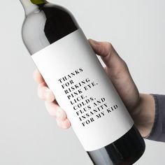 a hand holding a bottle of wine that says, thanks for raising high fives