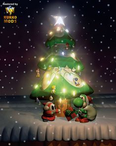 a christmas tree with mario kart and luigi on it in the middle of snow