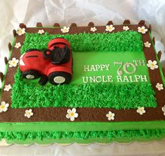 a birthday cake with a lawn mower and flowers on the side that says happy 70th uncle ralph