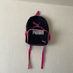 This Is An Unused Black And Pink Puma Backpack With One Pocket That Comes With A Matching Lunchbox That Is Used . The Length For The Backpack Is Around 43.5 Centimeters And The Width Is Around 31 Centimeters. The Lunchbox Length Is Around 24 Centimeters And The Width Is Around 27 Centimeters. Puma Backpack, The Lunchbox, Pink Pumas, Pink Backpack, Black And Pink, Kids Shop, Black Pink, Backpacks, Pink